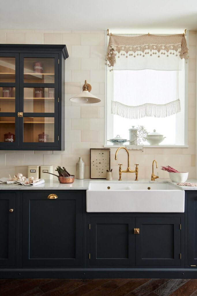black kitchen cabinets beige backsplash