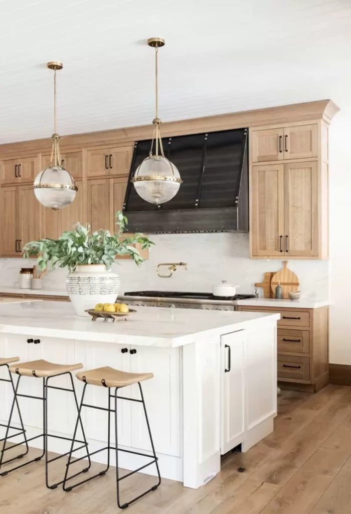 large kitchen white white island and wood cabinets